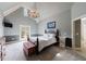 Bright bedroom with vaulted ceiling, chandelier, and french doors leading to the backyard at 3250 Twisted Branches Ln, Marietta, GA 30068