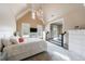 Bedroom boasting vaulted ceiling, white trim, and an open concept design with an adjacent playroom at 3250 Twisted Branches Ln, Marietta, GA 30068