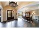 Formal dining room with hardwood floors, elegant chandelier, and large window for ample natural light at 3250 Twisted Branches Ln, Marietta, GA 30068