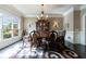 Bright dining room featuring hardwood floors, large window, and decorative chandelier at 3250 Twisted Branches Ln, Marietta, GA 30068