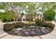 Beautiful exterior view of home with brick facade, mature trees, and expertly landscaped yard at 3250 Twisted Branches Ln, Marietta, GA 30068