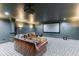 A cozy home theater is furnished with a large screen and comfortable leather seating at 3250 Twisted Branches Ln, Marietta, GA 30068