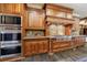 Well-equipped kitchen with wooden cabinets, stainless steel appliances, and modern amenities at 3250 Twisted Branches Ln, Marietta, GA 30068