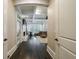Hallway view leading to living room with beamed ceilings, fireplace and seating area at 3250 Twisted Branches Ln, Marietta, GA 30068