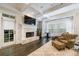 Inviting living room features a fireplace, plush seating, and natural light, perfect for relaxation and entertainment at 3250 Twisted Branches Ln, Marietta, GA 30068