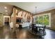Inviting living room with hardwood floors, stone walls, a fireplace, and ample natural light at 3250 Twisted Branches Ln, Marietta, GA 30068