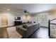 Cozy living room with a large sectional sofa and entertainment center, perfect for Gathering movie nights at 3250 Twisted Branches Ln, Marietta, GA 30068