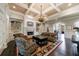 Elegant living room featuring a fireplace, built-in shelves, and coffered ceilings at 3250 Twisted Branches Ln, Marietta, GA 30068