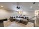 Spacious living room features a large sectional sofa, ceiling fan, and neutral decor at 3250 Twisted Branches Ln, Marietta, GA 30068