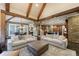 Open-concept living room connects to the dining and kitchen areas, featuring exposed beams and ample seating at 3250 Twisted Branches Ln, Marietta, GA 30068
