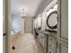 Elegant main bathroom featuring dual vanities, granite countertops, and a chandelier, exuding sophistication and style at 3250 Twisted Branches Ln, Marietta, GA 30068