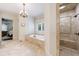 Spa-like main bathroom with a soaking tub and walk-in shower, designed for ultimate relaxation at 3250 Twisted Branches Ln, Marietta, GA 30068