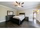 Cozy main bedroom showcasing dark wood furniture, neutral paint, and great natural light at 3250 Twisted Branches Ln, Marietta, GA 30068