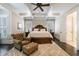 Spacious main bedroom with trey ceiling, ceiling fan, and sitting area, offering a luxurious retreat at 3250 Twisted Branches Ln, Marietta, GA 30068