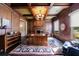 Executive office with wood paneled walls, coffered ceiling, fireplace, and custom built-ins at 3250 Twisted Branches Ln, Marietta, GA 30068