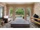 Beautiful outdoor space boasts brick archways, a grill, and a view of the pool at 3250 Twisted Branches Ln, Marietta, GA 30068