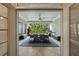 Covered outdoor patio with a full dining set and views of the lush backyard at 3250 Twisted Branches Ln, Marietta, GA 30068