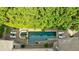Aerial view of private backyard swimming pool surrounded by lush greenery and lounge chairs at 3250 Twisted Branches Ln, Marietta, GA 30068
