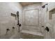 Luxurious walk-in shower with multiple shower heads and a built-in seat, providing a spa-like experience at 3250 Twisted Branches Ln, Marietta, GA 30068