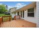 Inviting back deck features wood railing and french doors to bring the outside in at 3451 Birchwood Trl, Snellville, GA 30078