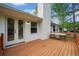 Inviting back deck features wood railing and french doors to bring the outside in at 3451 Birchwood Trl, Snellville, GA 30078