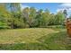Large grassy backyard and raised deck is ideal for relaxation and entertaining at 3451 Birchwood Trl, Snellville, GA 30078