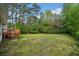 Large grassy backyard and raised deck is ideal for relaxation and entertaining at 3451 Birchwood Trl, Snellville, GA 30078