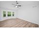 Bright main bedroom with new floors, ceiling fan, and bay window at 3451 Birchwood Trl, Snellville, GA 30078