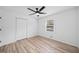 Bedroom with new floors, white walls, closet, and a ceiling fan at 3451 Birchwood Trl, Snellville, GA 30078