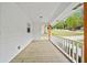 A view from the front porch, featuring wood floors and white railings at 3451 Birchwood Trl, Snellville, GA 30078