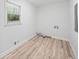 Empty laundry room with light wood floors at 3451 Birchwood Trl, Snellville, GA 30078