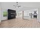 Open-concept living room leading to a modern kitchen with stainless steel appliances at 3451 Birchwood Trl, Snellville, GA 30078