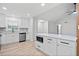 Open concept kitchen and living room with a kitchen island and recessed lighting at 3451 Birchwood Trl, Snellville, GA 30078