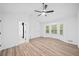 Spacious main bedroom with vaulted ceilings, light wood flooring, and natural light from the bay window at 3451 Birchwood Trl, Snellville, GA 30078