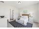 This bedroom features neutral paint, carpet, and a decorative rug at 3698 Annsbury Ct, Lilburn, GA 30047