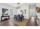 Cozy dining room with stylish decor, wood floors, and a view into the adjacent hallway at 3698 Annsbury Ct, Lilburn, GA 30047