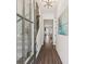 Stylish entryway with hardwood floors, a staircase with iron railings, and a view of the living room at 3698 Annsbury Ct, Lilburn, GA 30047