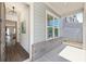 Elegant entryway with hardwood floors, a modern chandelier, and views of the home's interior at 3698 Annsbury Ct, Lilburn, GA 30047