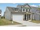 Stylish two-story home with a two-car garage, covered entryway, and a well-maintained front lawn at 3698 Annsbury Ct, Lilburn, GA 30047