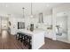 Bright kitchen with stainless steel appliances, quartz countertops, and a breakfast bar with pendant lighting at 3698 Annsbury Ct, Lilburn, GA 30047
