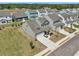 New construction neighborhood of homes with matching architecture, landscaping, and sidewalks at 3698 Annsbury Ct, Lilburn, GA 30047