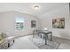 This light and airy home office has a desk, chair, and neutral walls and carpet at 3698 Annsbury Ct, Lilburn, GA 30047