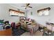 A bedroom featuring a bed, two windows with curtains and a ceiling fan at 5335 Old Floyd Sw Rd, Mableton, GA 30126