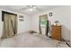 Bedroom with carpet flooring, gold curtains, and a wooden dresser at 5335 Old Floyd Sw Rd, Mableton, GA 30126