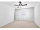 Bedroom featuring neutral walls, carpeting, and a ceiling fan at 7375 Cavaletti Cir, Cumming, GA 30040