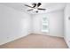 Bedroom featuring neutral walls, carpeting, a window, and a ceiling fan at 7375 Cavaletti Cir, Cumming, GA 30040