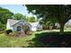 Beautifully landscaped front yard with well-maintained grass, mature trees, and manicured garden beds enhancing the curb appeal at 7375 Cavaletti Cir, Cumming, GA 30040