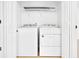 Laundry room featuring a modern washer and dryer with ample storage at 7375 Cavaletti Cir, Cumming, GA 30040