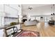 Bright, open-concept living room featuring hardwood floors, vaulted ceilings, and stylish decor at 7375 Cavaletti Cir, Cumming, GA 30040