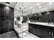 Modern bathroom with tiled walls, white marble floors and double vanity at 1009 Riverbend Club Se Dr, Atlanta, GA 30339